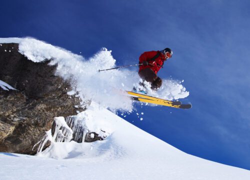 Skier jumping on snowy slope